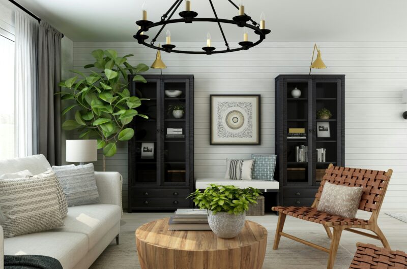 Modern living room with budget-friendly home decor updates, including layered rugs, throw pillows, and indoor plants – affordable ways to refresh your home without renovation